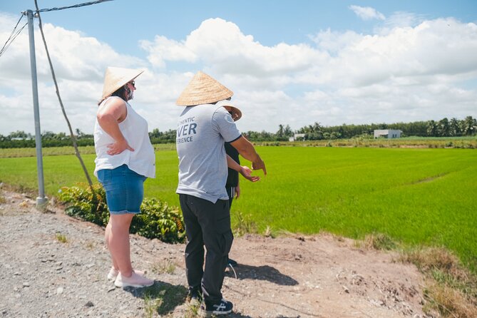 Authentic Mekong Delta Tour With Local Experts - Coconut, fruit, and Mekong whiskey at a family homestead