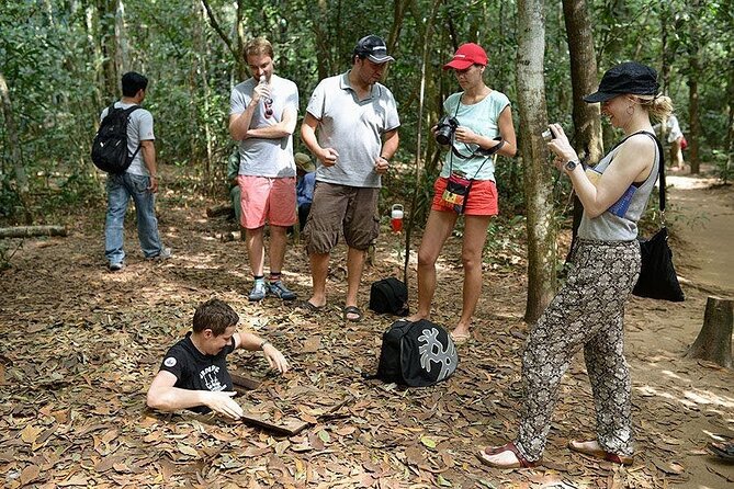 Cu Chi Tunnels - Half Day Morning or Afternoon Luxury Tours - Following the guide through Cu Chi