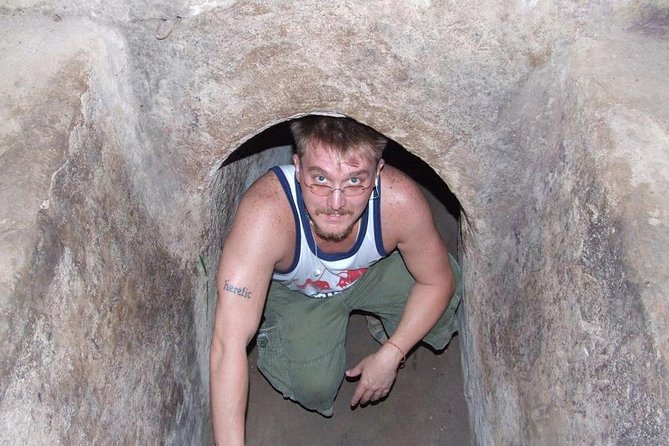 HCM: Cu Chi Tunnels-Tapioca Small Group Tour Morning or Afternoon - Crawling through a narrow tunnel