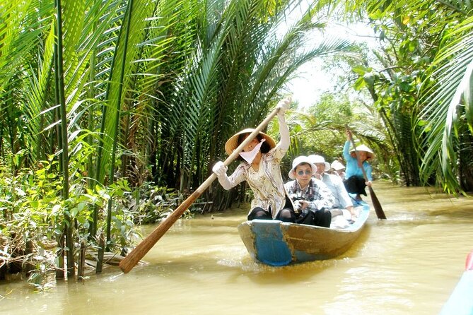 Ho Chi Minh: Best Seller of Cu Chi Tunnel & Mekong Delta Cruise - Coconut candy, fruit, and village music