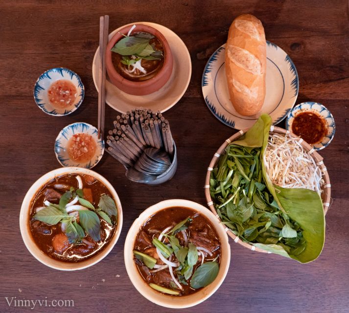 Ho Chi Minh City: Private Street Food Motorbike Tour - Old apartments, a pagoda, and a different view of Saigon