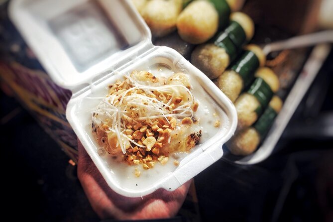 Ho Chi Minh City Street Food Tour & Sightseeing By Motorbike - Walking through Ho Thi Ky Flower Market
