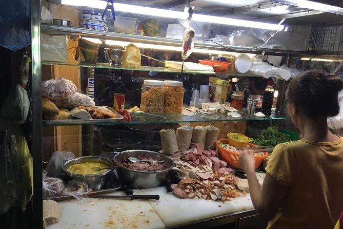 Ho Chi Minh City: Street Food Walking Tour with 12 Tastings - Starting with Vietnamese coffee and savory classics