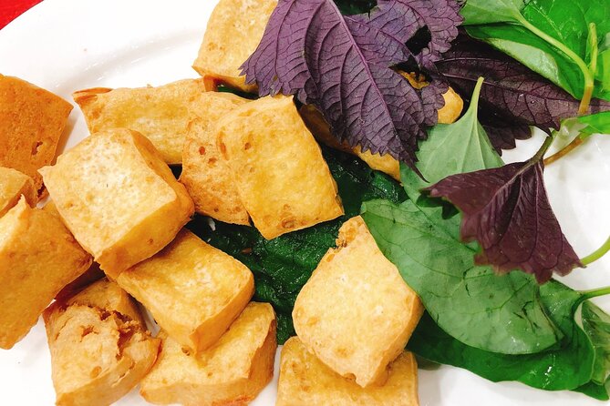 Ho Chi Minh Nightlife & Street Food Tour By Motorbike - Dinner is spread across local food stops