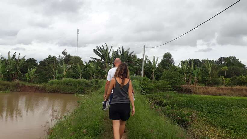 Mekong Day Tour by Car:Cai Be market, Local Island & Cycling - The hand-rowed sampan through narrow canals