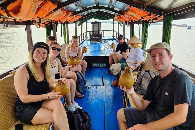 My Tho - Mekong Delta One Day Guided Trip Best Excursion HCM City - Taking the Motorized Boat Across the Mekong