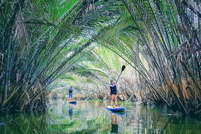 Paddling to explore the historic Vietnam War Rach Chiec jungle, - Getting comfortable on a stand-up paddleboard