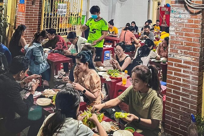 Private Street Food Tour by Motorbike/Car with Local Students - Tasting 2: Barbecue pork with rice noodles