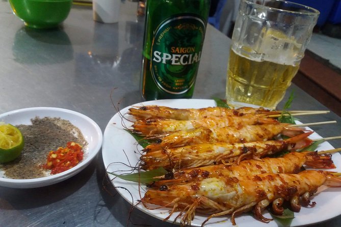 Saigon After Dark and Street Food by Motorbike and Scooter - Flowers, fashion, and the city in motion