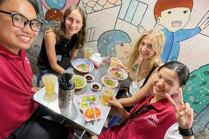 Saigon By Night: Authentic Street Food Scooter Adventure - Ho Thi Ky Flower Market and city night scenes