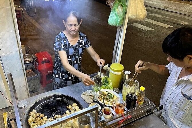Saigon Evening Walking Street Food Tour - The night flower market and coconut dessert