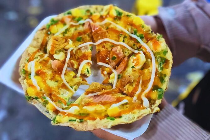 Saigon Food Tour by Scooter with Eleven Tastings - District 5 delivers the bánh mì stop