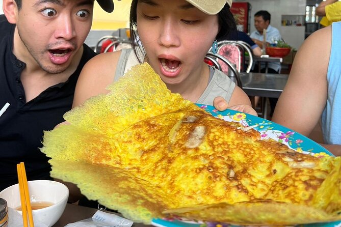 Saigon Food Tour by Scooter with Eleven Tastings - District 3 starts with grilled banana sticky rice