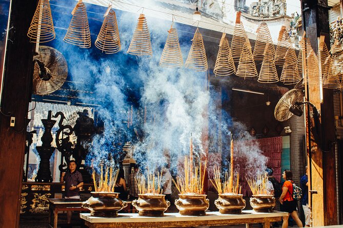 Saigon Unseen, History, & Hidden Gems Sightseeing Motorbike Tour - Chinatown and an ancient temple in District 5