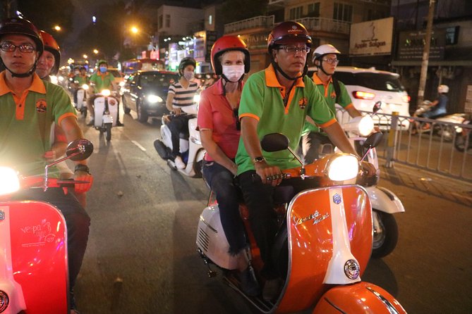 Saigon Vespa By Night Street Food Tour 4,5 Hours - Two restaurant stops and a full dinner