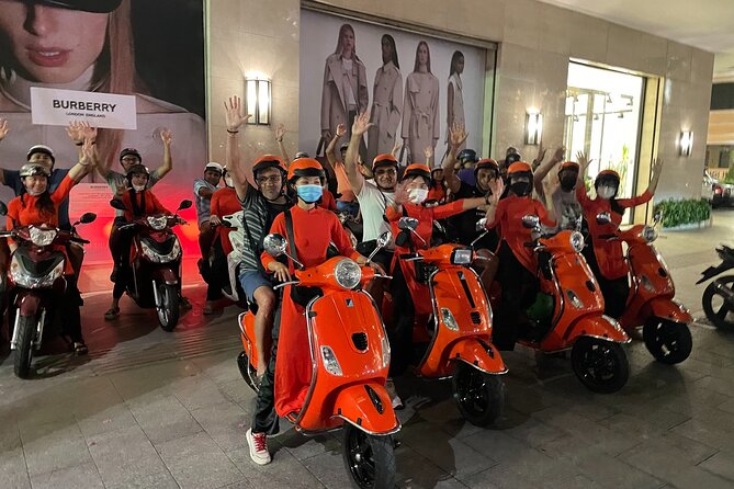 Saigon Vespa By Night Street Food With Female Riders Ao Dai - Seeing Saigon from a Vespa after dark