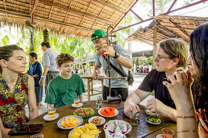 Small-Group Mekong Delta Day Trip: Boat Ride, Cottages & Pagoda - Garden paths, village cycling, and narrow canals