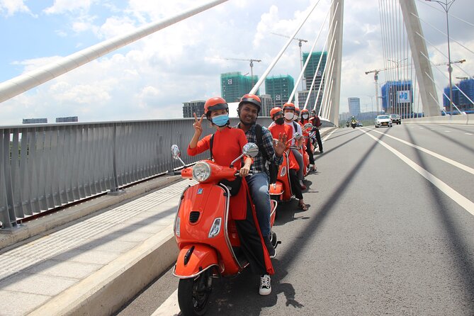 The Insider's Saigon With Female Ao Dai Riders Vespa 4,5 Hours - Pickup, timing, and group size
