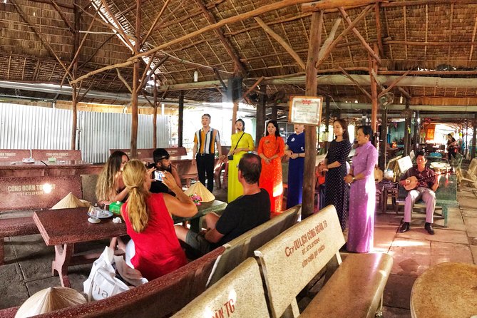 VIP Tour Cuchi Tunnels & Mekong Delta Cruise Full Day Group 12pax - Folk music on a Mekong islet